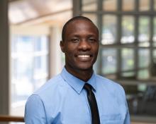 Headshot of Charles Omosa.